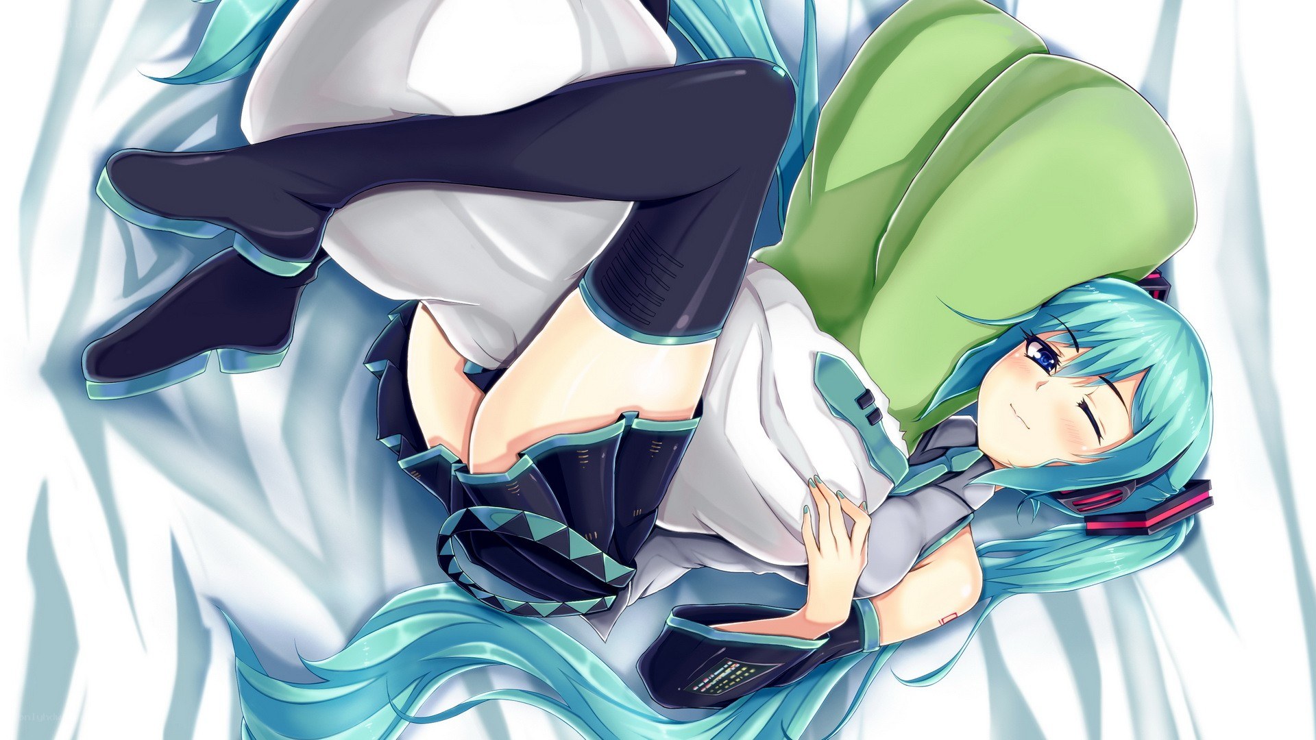 Miku lying on a bed