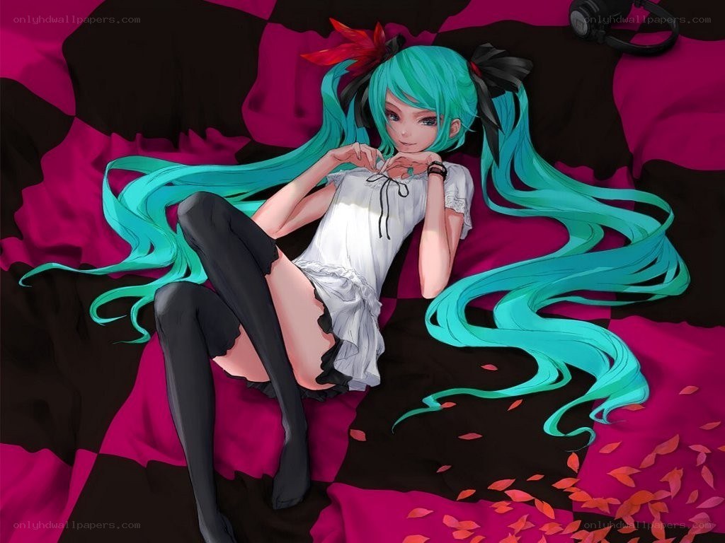 Miku lying on a bed