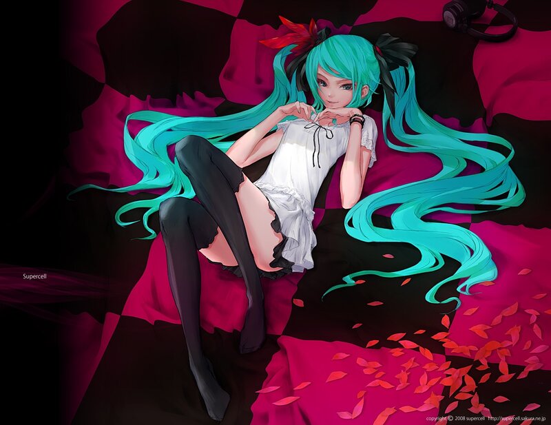 Miku lying on a bed