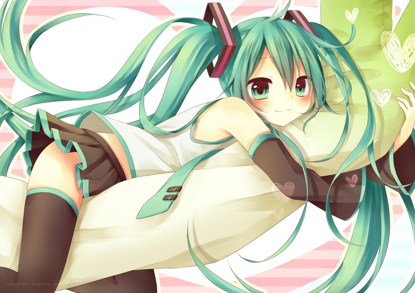 Miku lying on a pillow