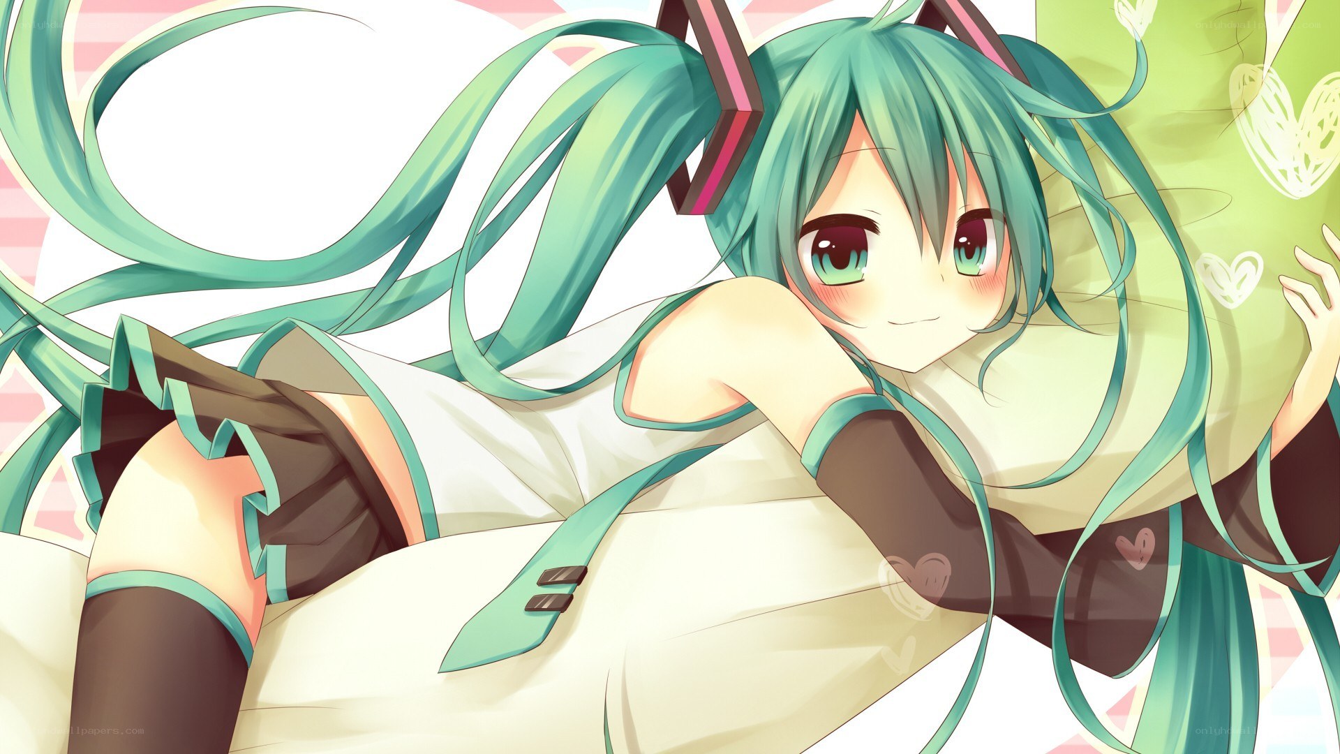 Miku lying on a pillow
