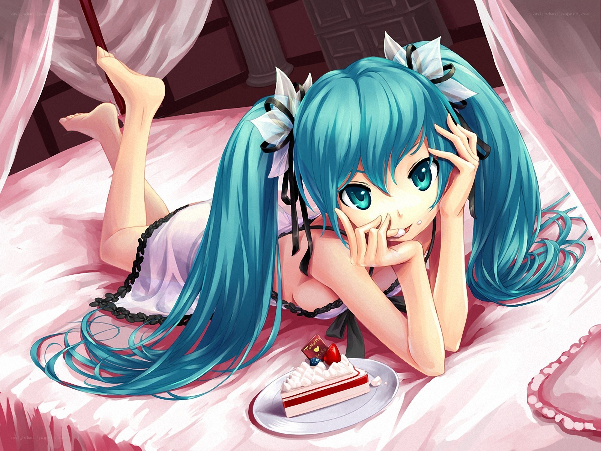 Miku on a pink bed with cake