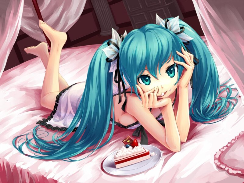 Miku with cake on bed