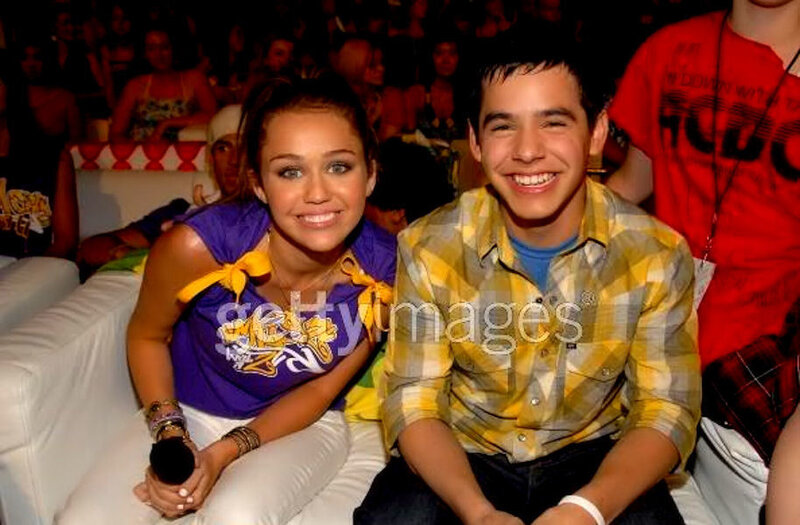 Miley Cyrus and a fan at an event