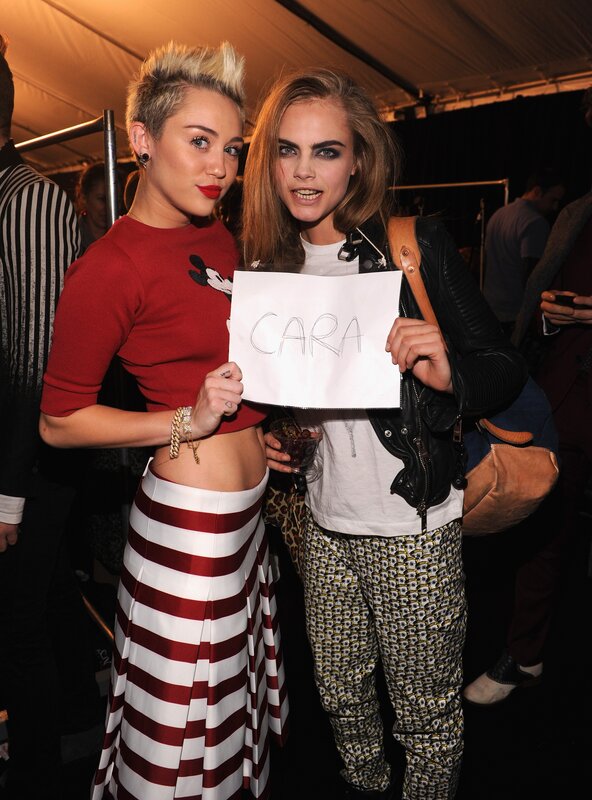 Miley Cyrus and Cara Delevingne at event