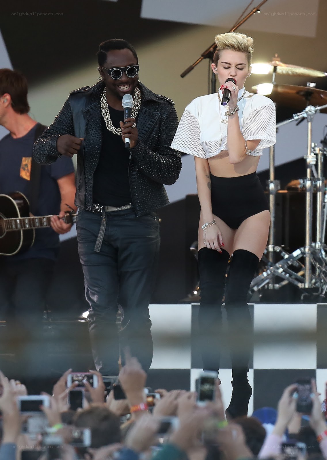 Miley Cyrus and Wiz Khalifa performing