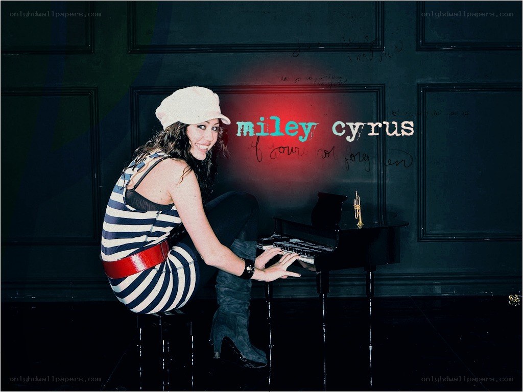 Miley Cyrus at the piano