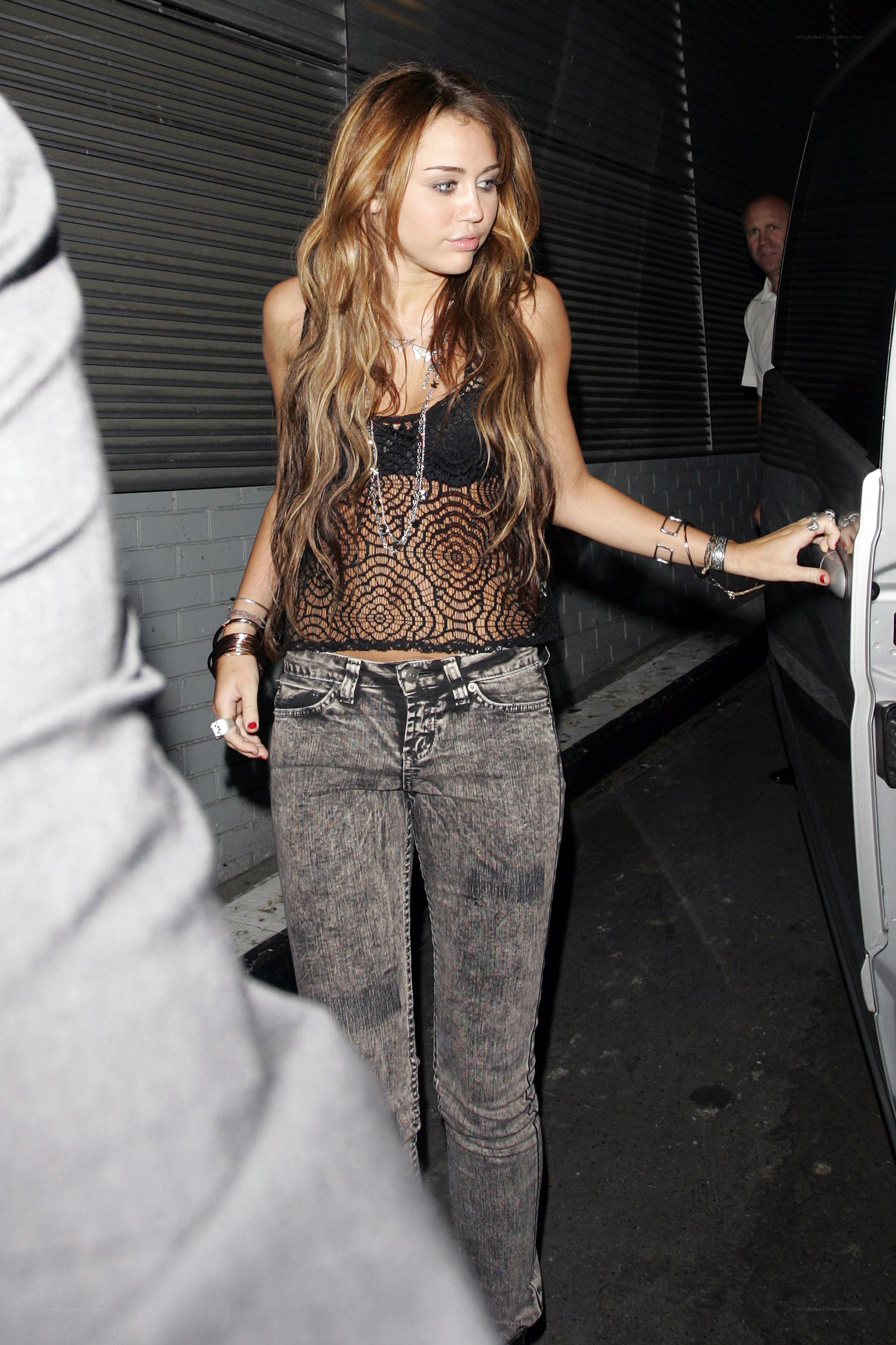 Miley Cyrus exiting a vehicle