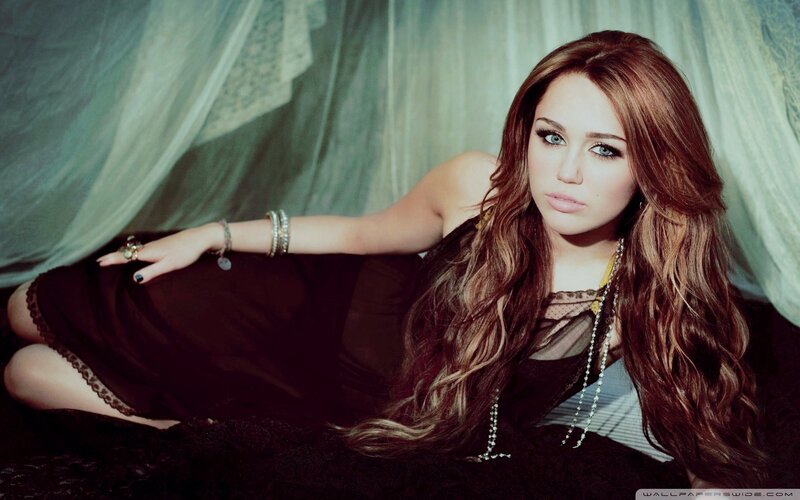 Miley Cyrus in a dark dress