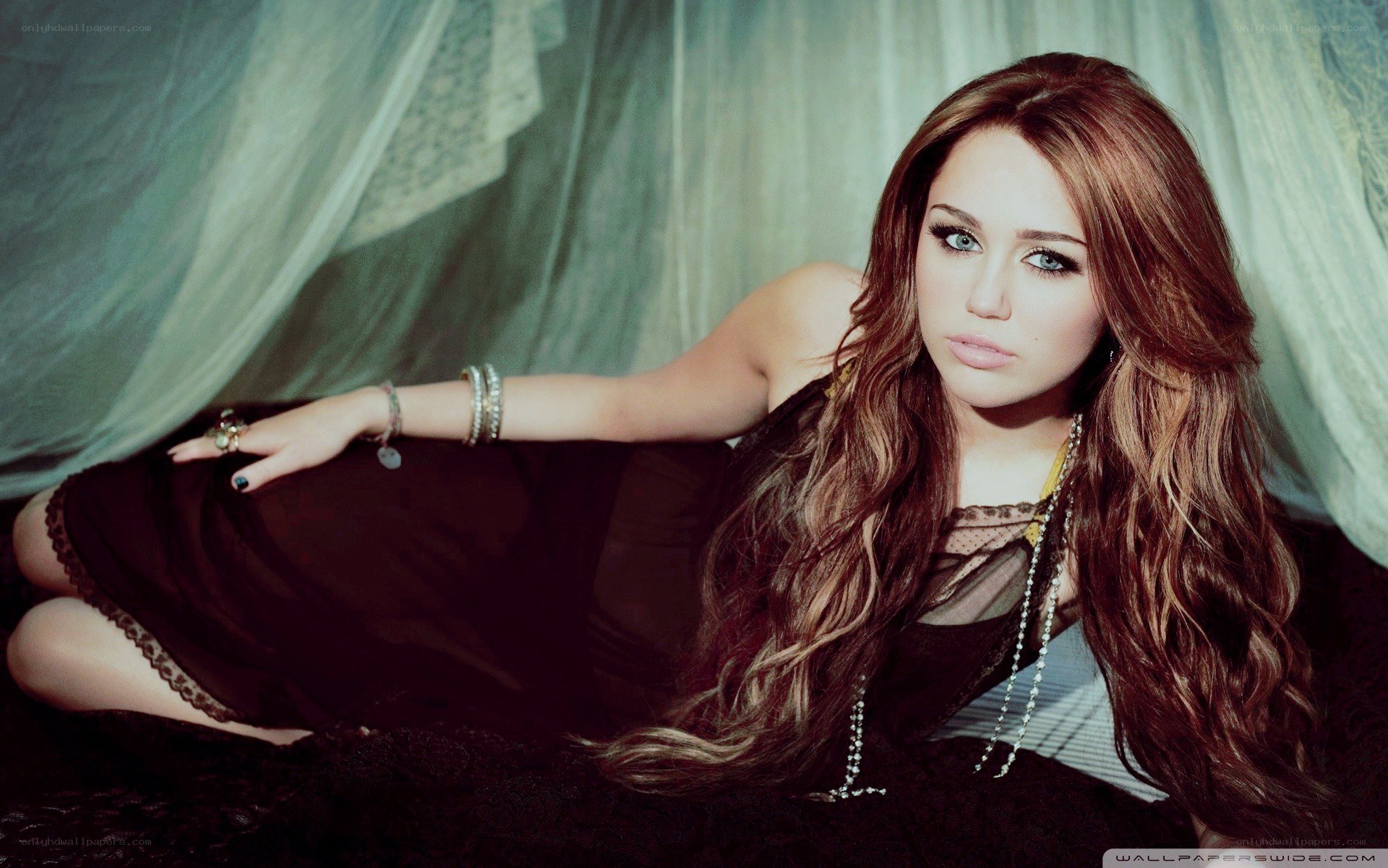 Miley Cyrus in a dark dress