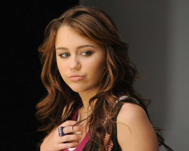 Miley Cyrus in a studio portrait