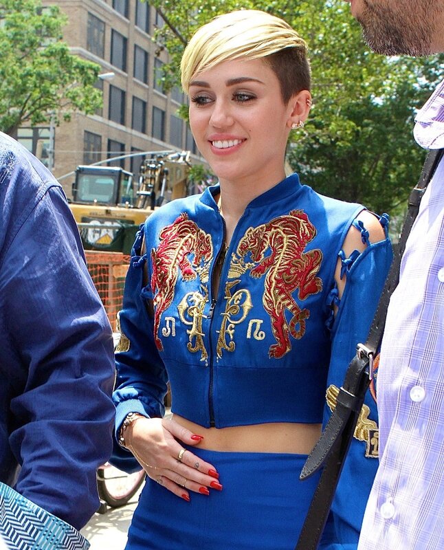 Miley Cyrus in blue jacket