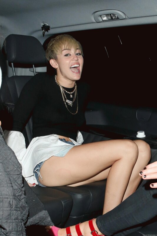 Miley Cyrus in car laughing