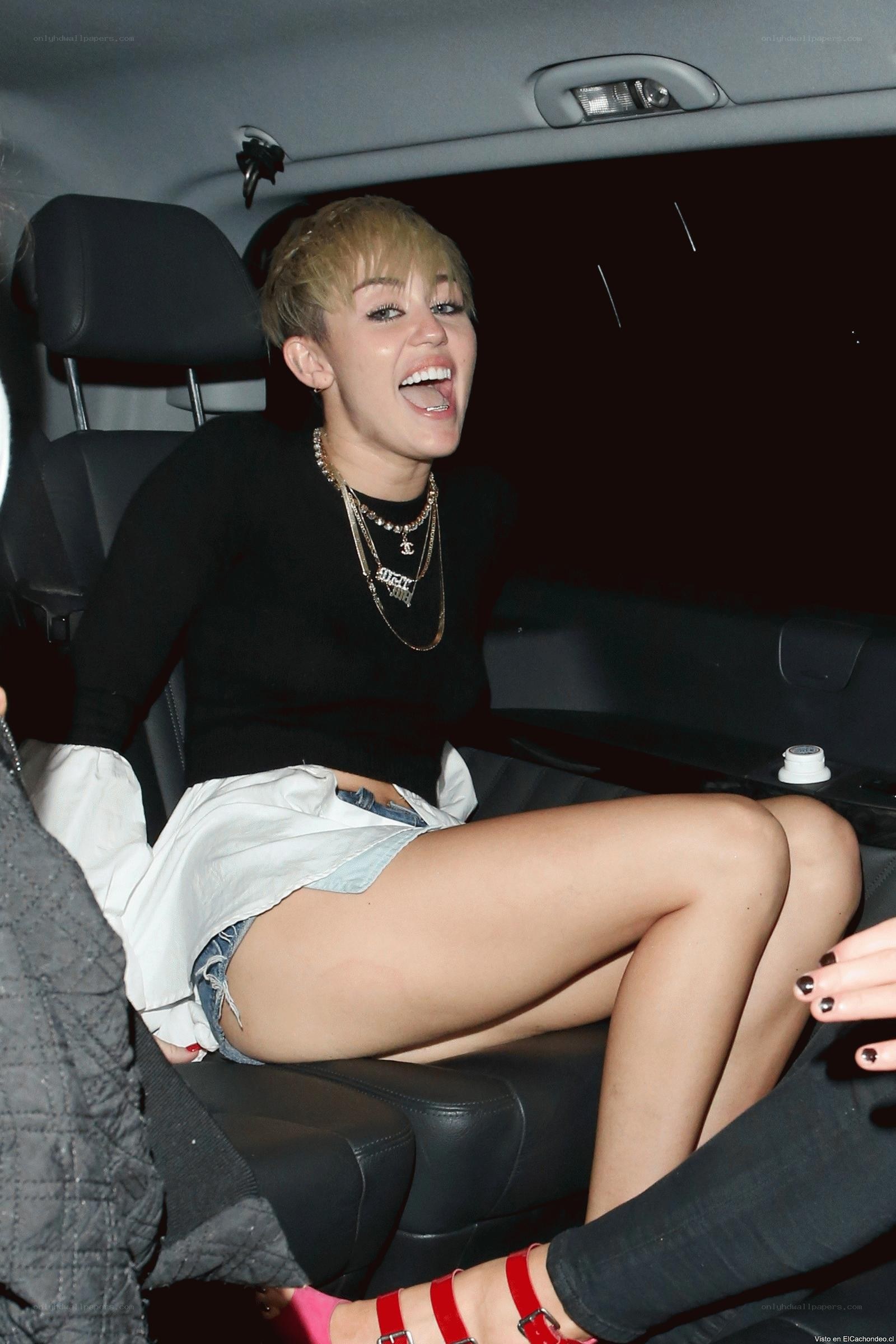 Miley Cyrus in car laughing