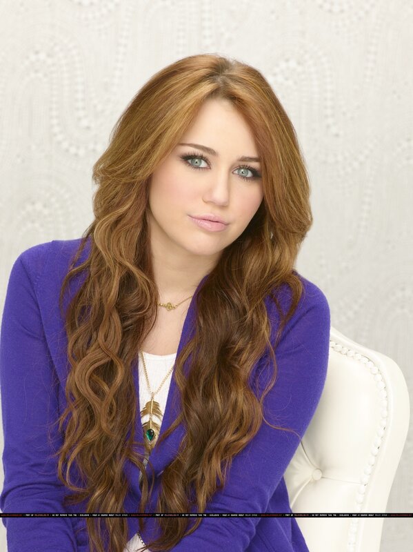 Miley Cyrus in purple cardigan