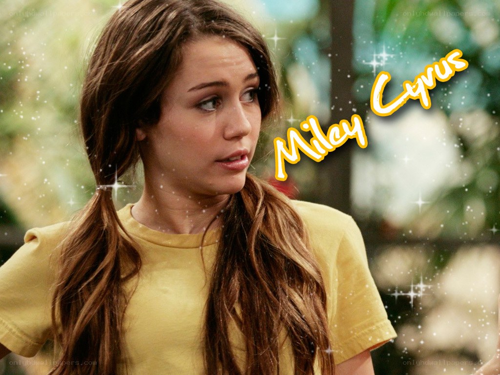 Miley Cyrus in yellow shirt