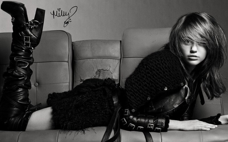 Miley Cyrus on a couch