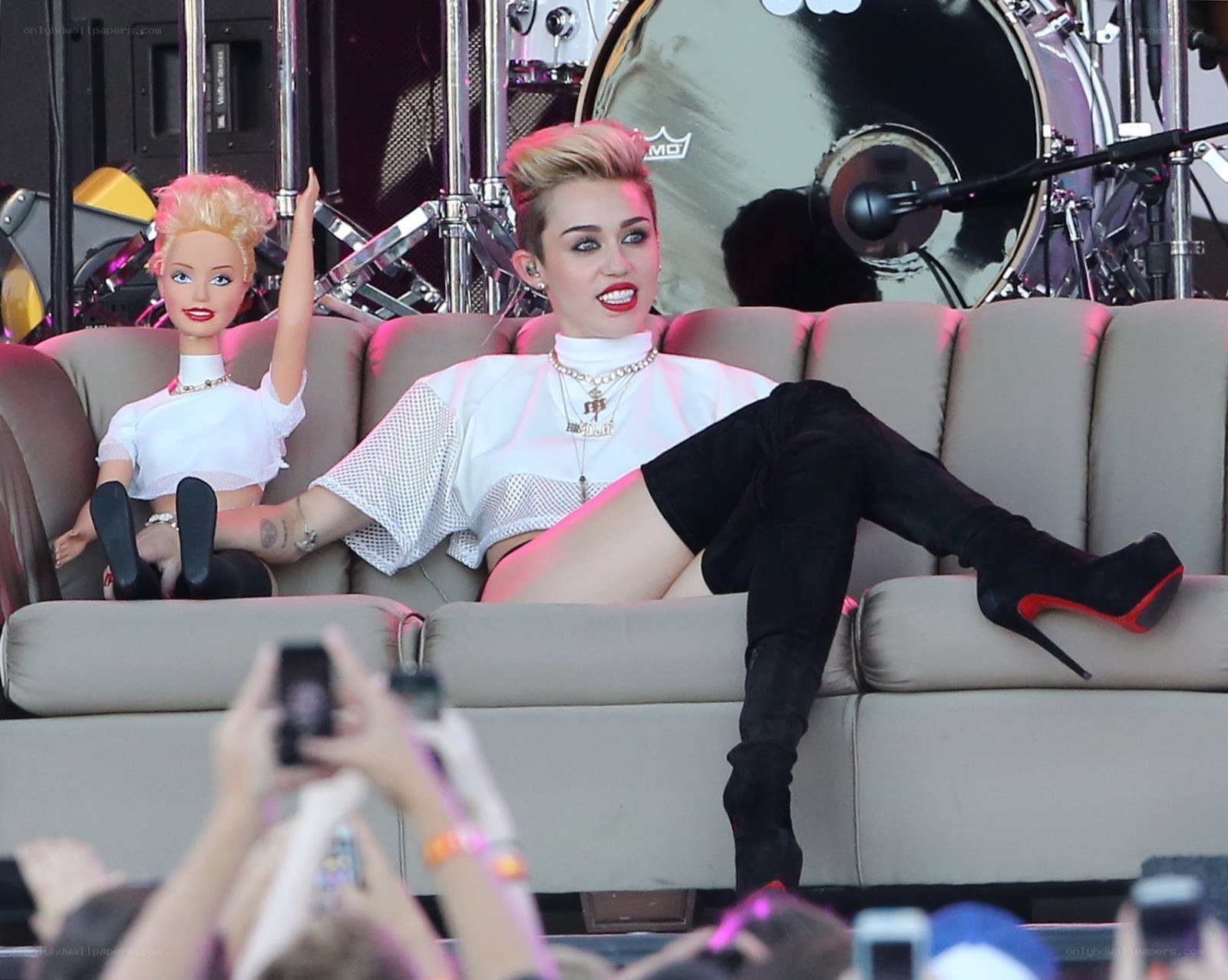 Miley Cyrus on stage with doll