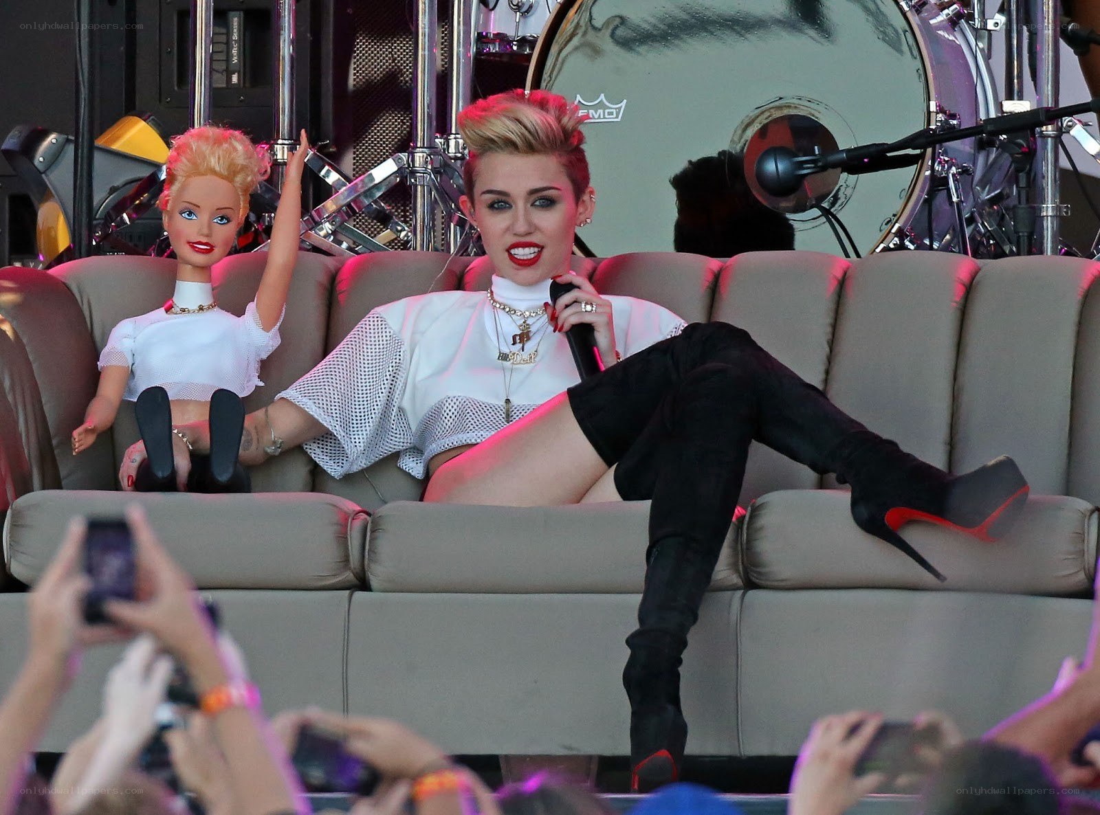 Miley Cyrus on stage with doll