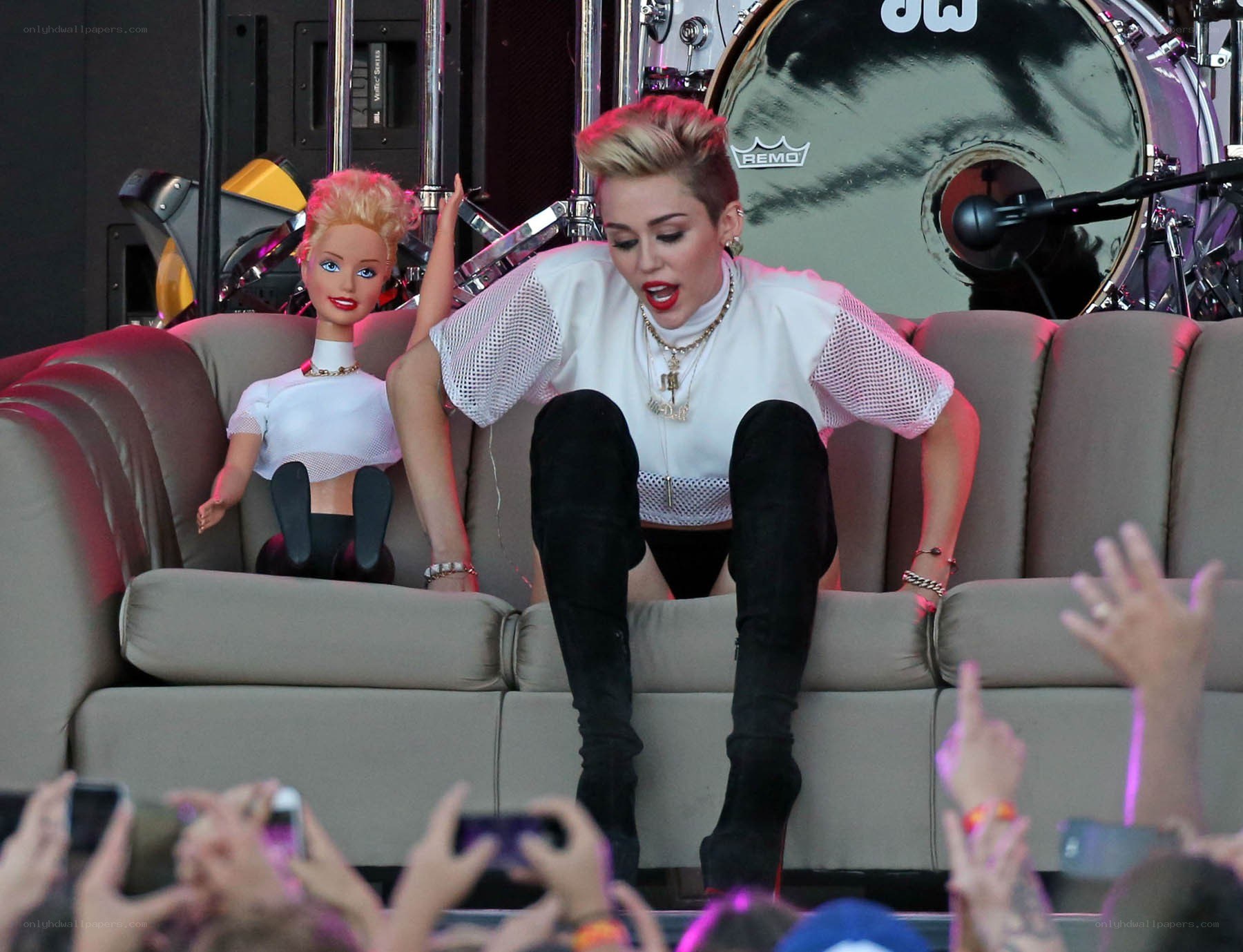 Miley Cyrus on stage with doll