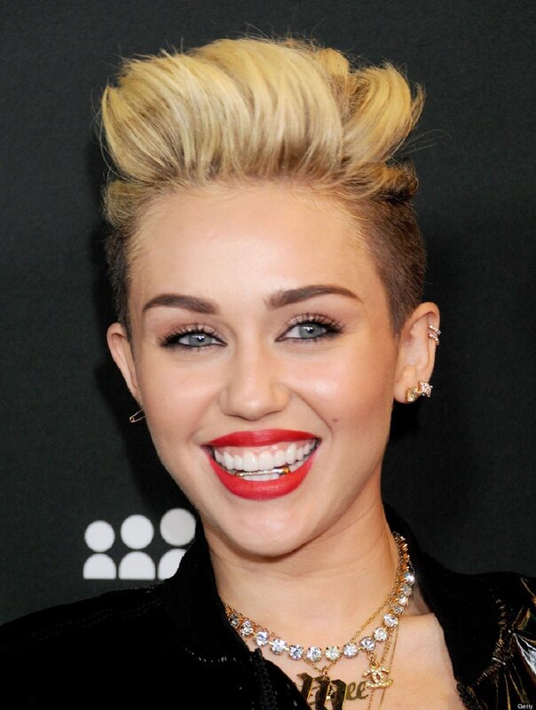Miley Cyrus smiling at event