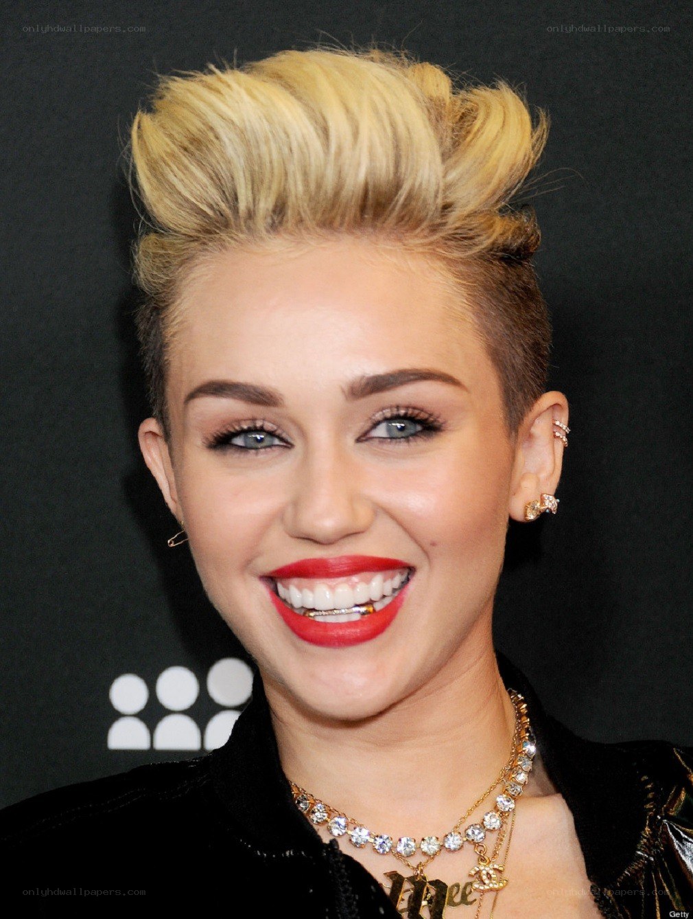 Miley Cyrus smiling at event