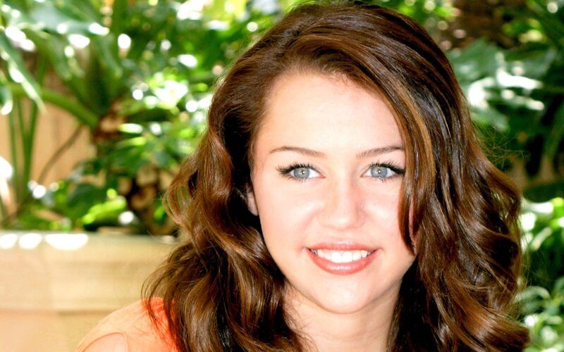 Miley Cyrus smiling outdoors