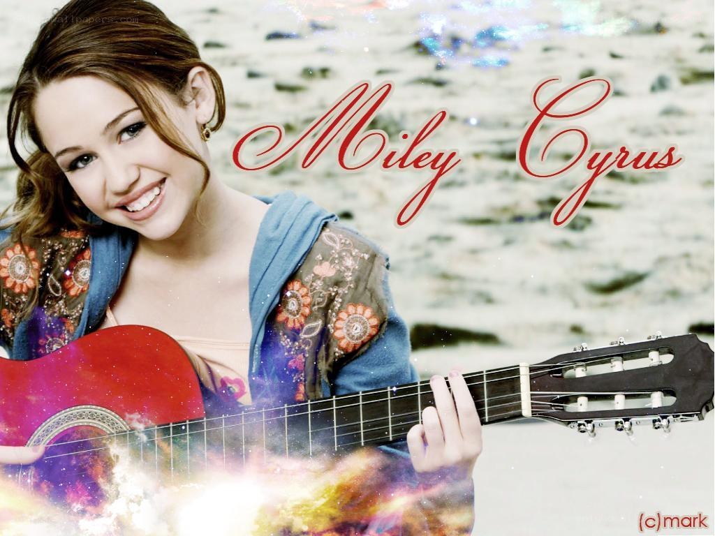 Miley Cyrus with guitar