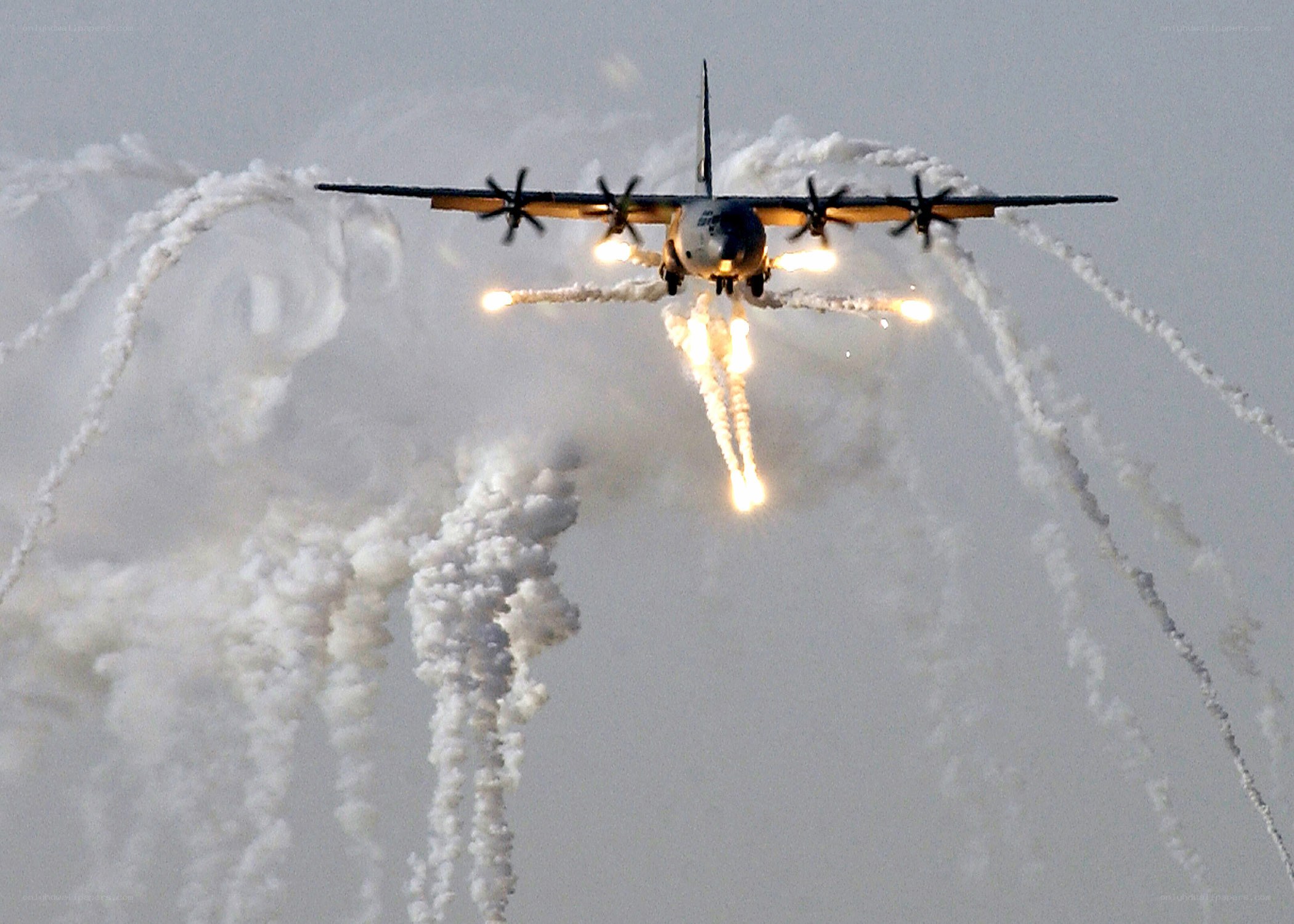 Military aircraft deploying flares