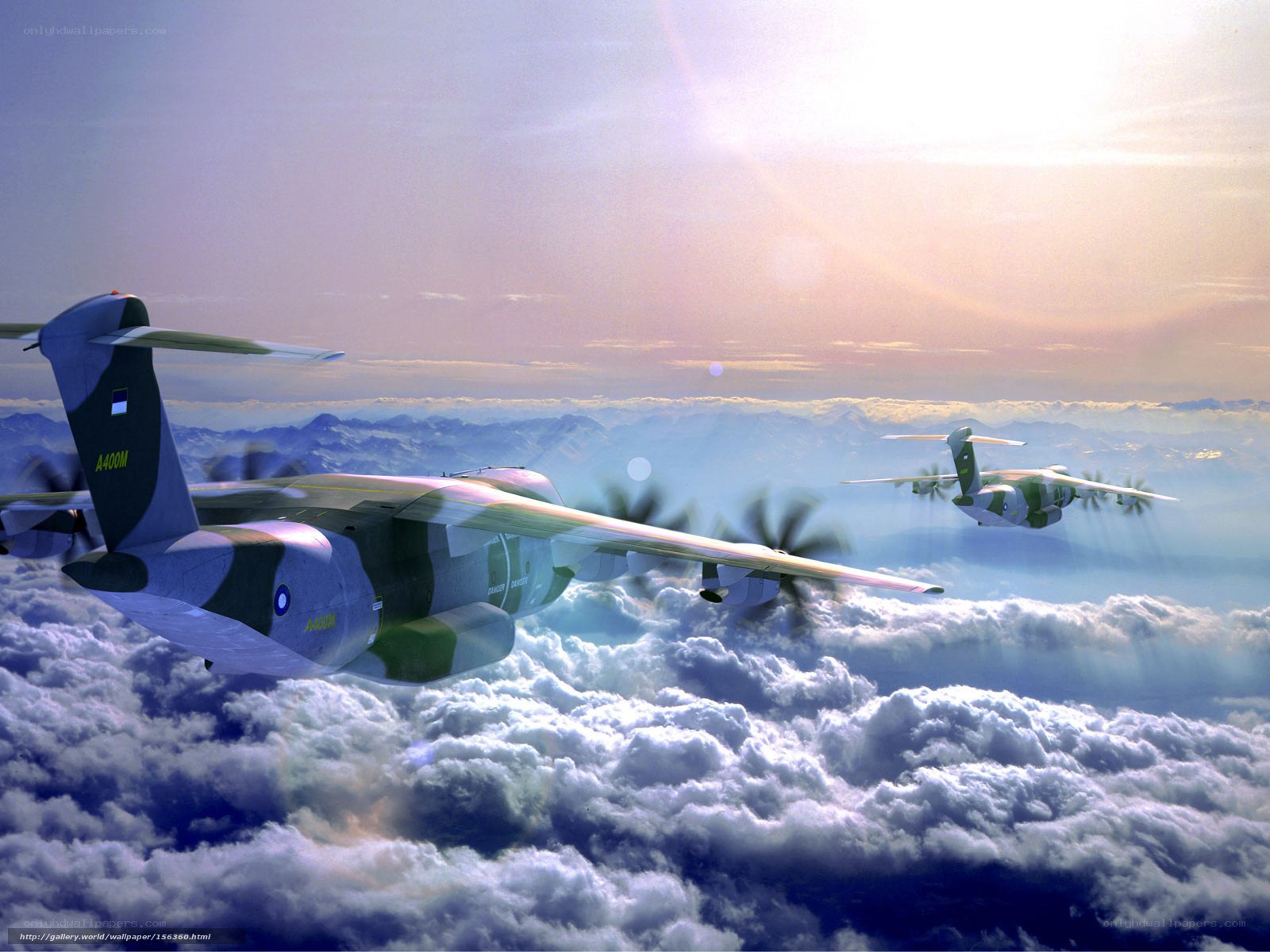 Military aircraft flying above clouds