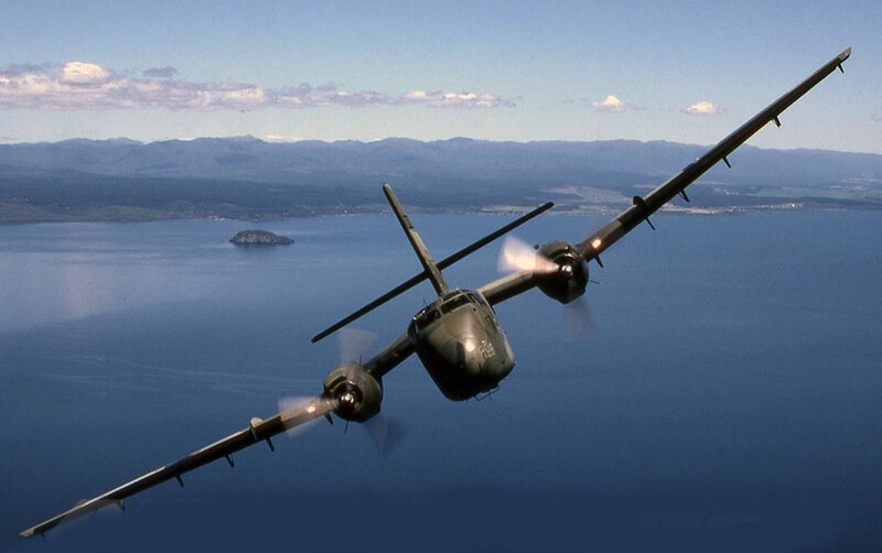 Military aircraft flying over water