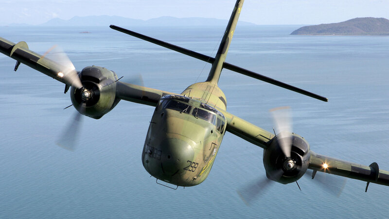 military aircraft flying over water
