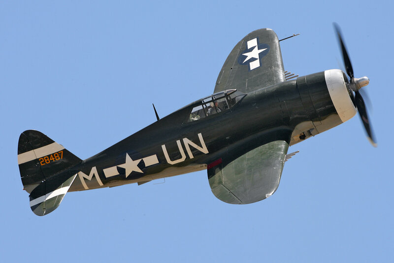 Military Aircraft in Flight — Blue, Clear, Afternoon