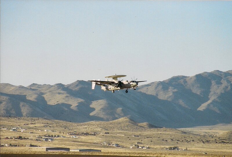 Military Aircraft in Flight — Brown, Calm