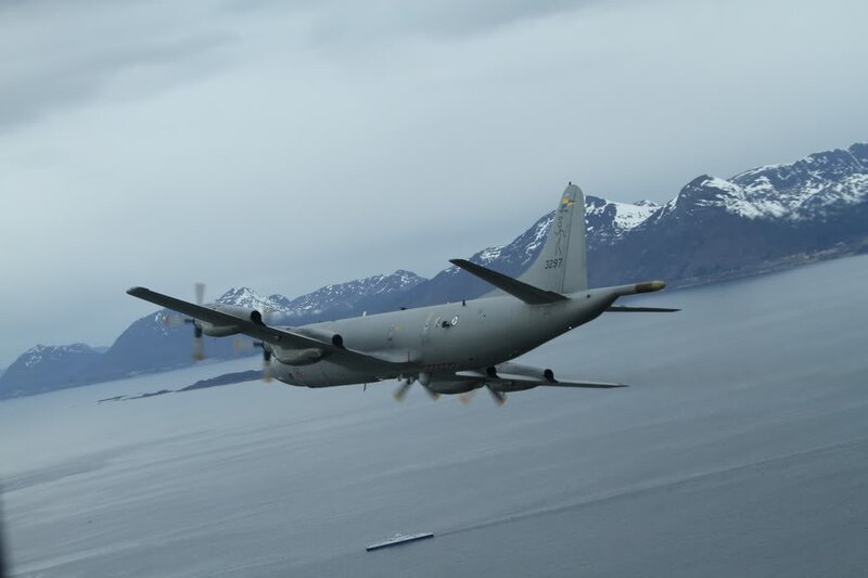 Military Aircraft in Flight — Gray, Overcast, Photograph