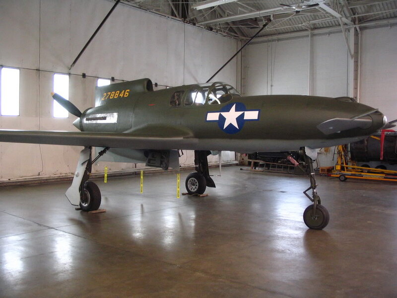Military Aircraft in Hangar — Green