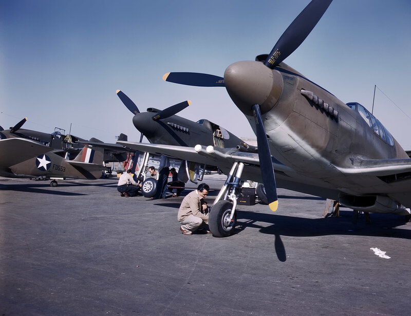 Military aircraft maintenance on tarmac