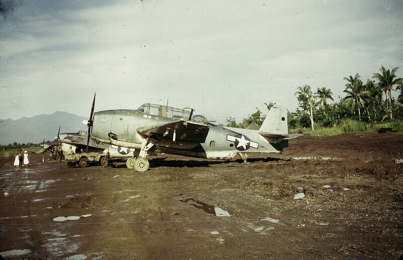 Military aircraft on muddy airfield