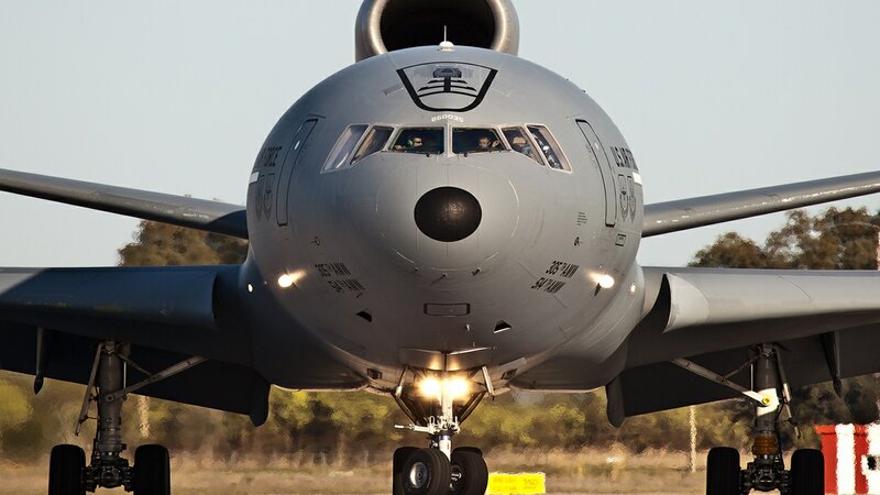 Military Aircraft on Runway — Gray, Dramatic