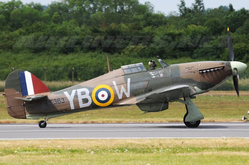 Military Aircraft on Runway — Green, Calm, Afternoon