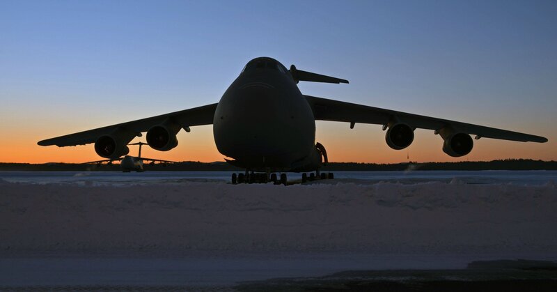 Military aircraft on snowy runway