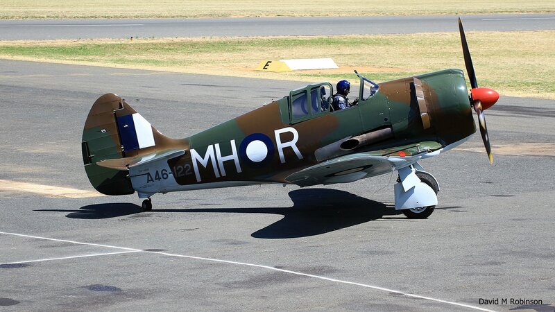 Military Aircraft on Tarmac — Green, Calm, Afternoon
