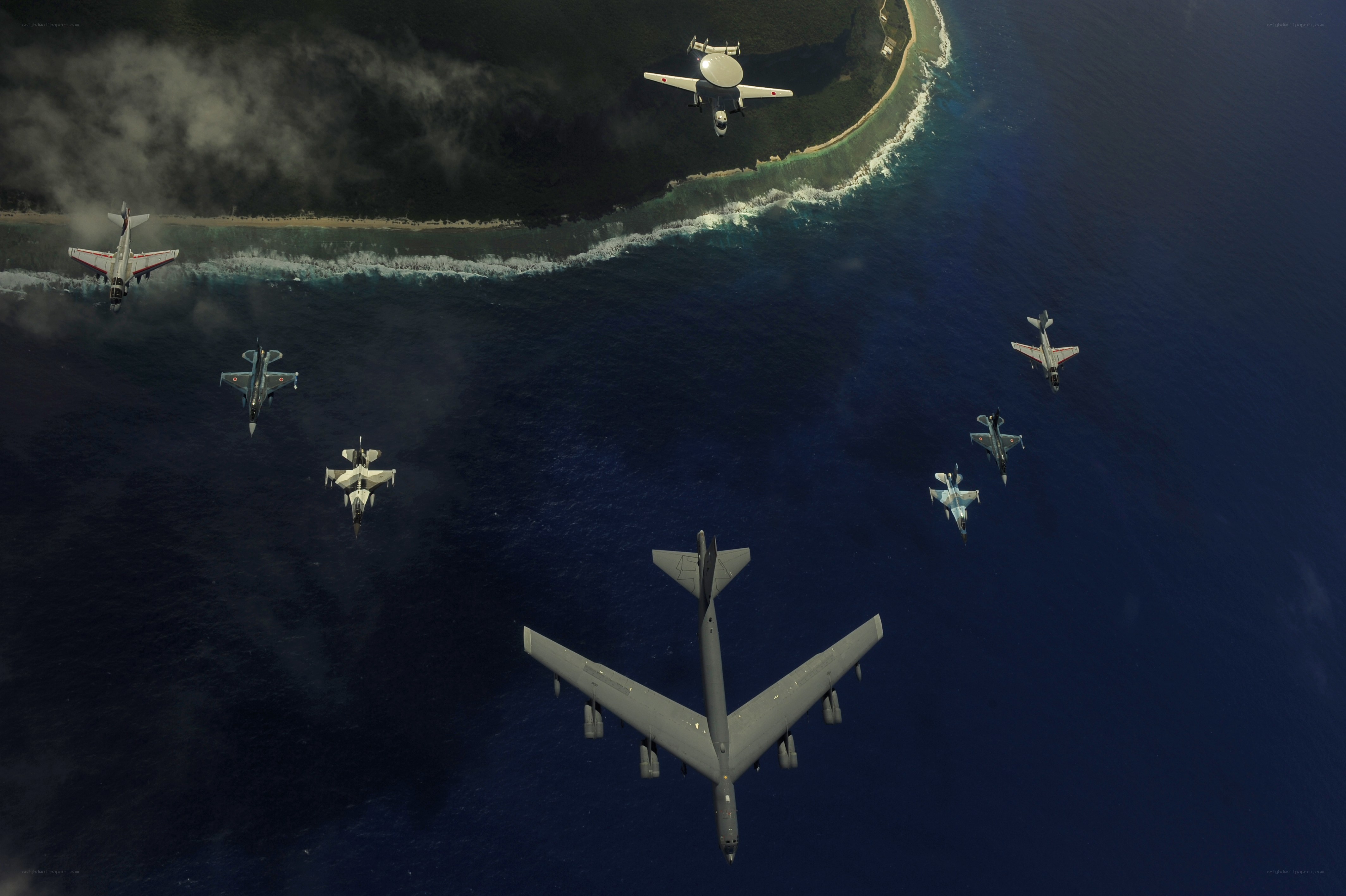 Military aircraft over island