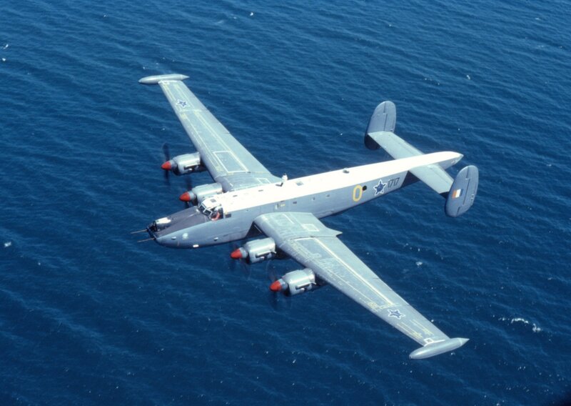 Military Aircraft over Ocean — Blue