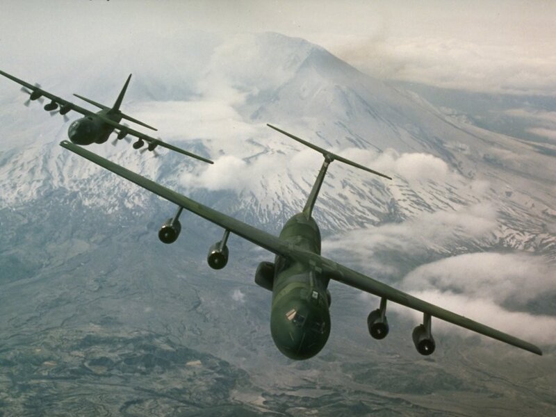 Military aircraft over snowy mountains