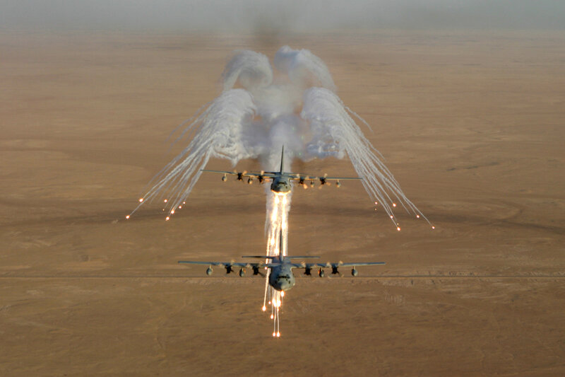 Military aircraft releasing flares