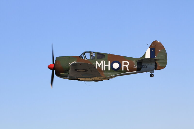 Military Airplane in Flight — Blue