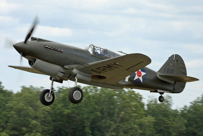 Military Airplane in Flight — Green, Dynamic, Afternoon