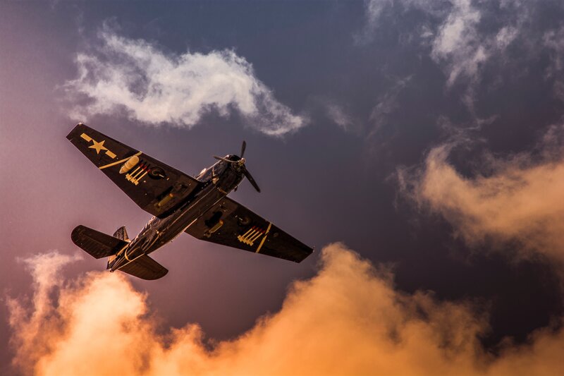 Military Airplane in Flight — Orange
