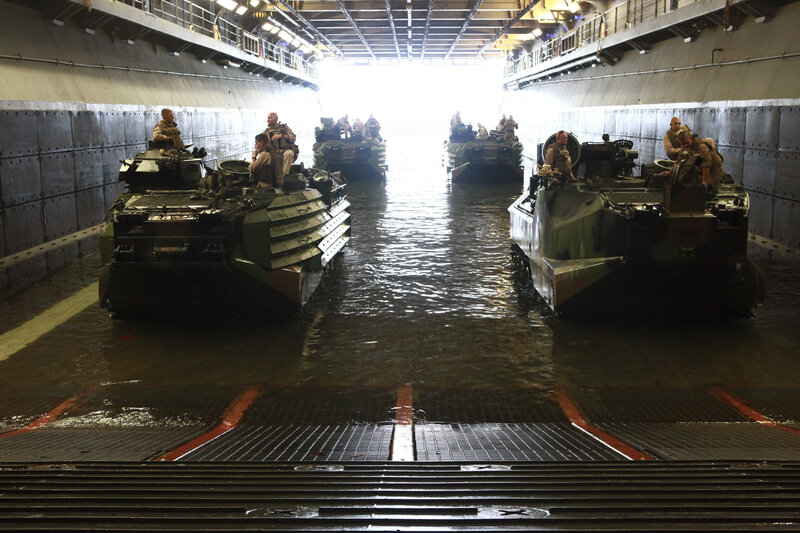 Military amphibious vehicles in ship hold